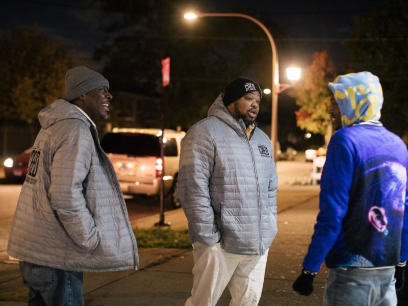 cred outreach workers talking on sidewalk