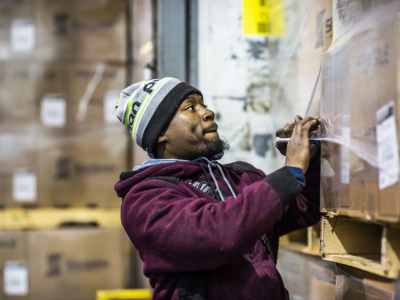 man working in shipping warehouse